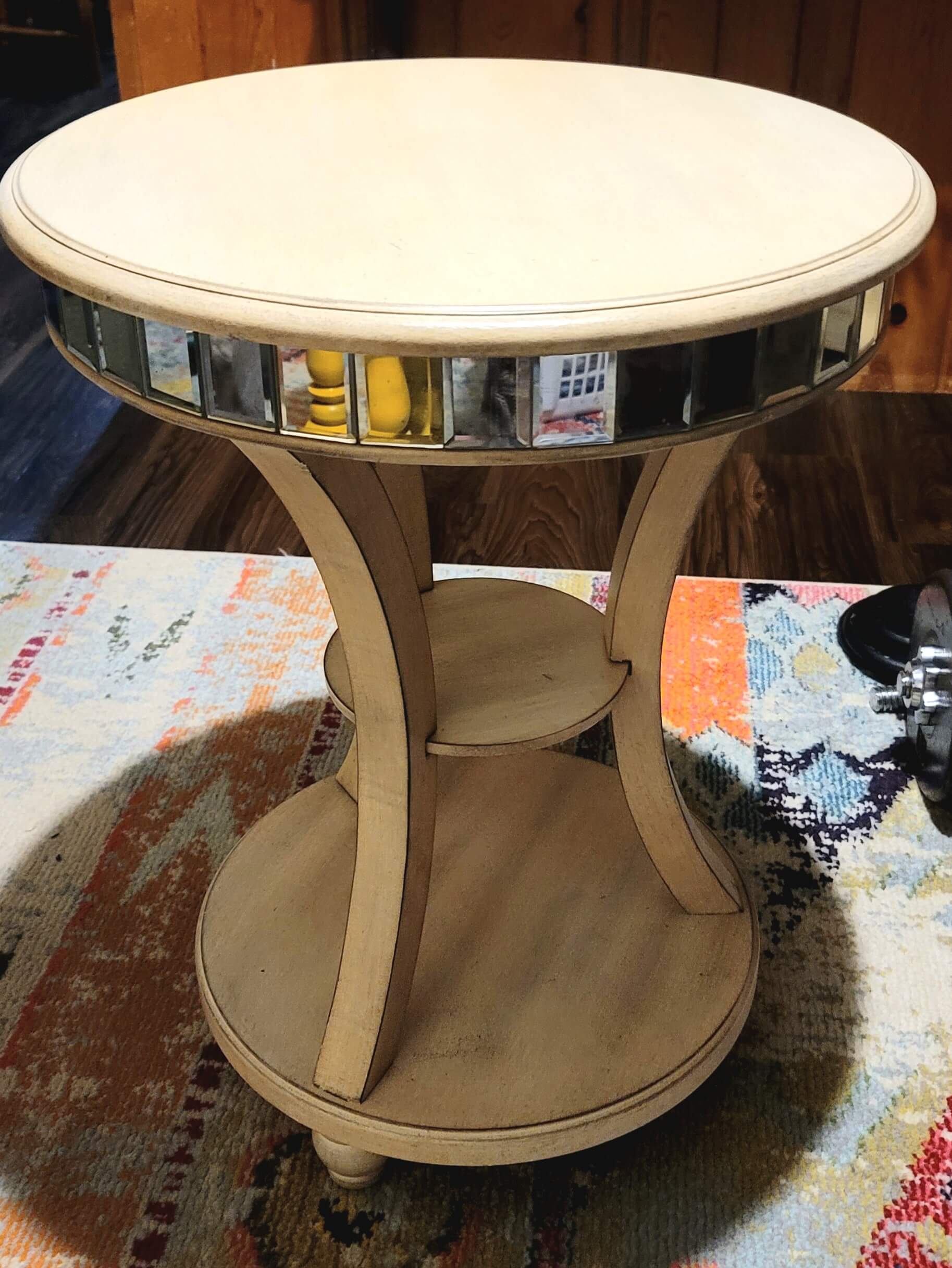 An end table with a custom glass top by Port Washington Glass.